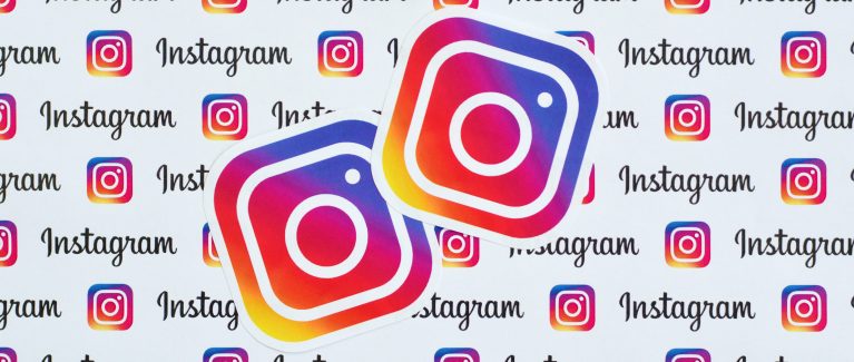 NY, USA - DECEMBER 5, 2019: Instagram pattern printed on paper with small instagram logos and inscriptions. Instagram is American photo and video-sharing social networking service owned by Facebook